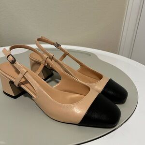 Two-toned, rounded toe pumps.